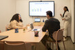 © ADDICTIVE STOCK - Collaborative Friends Engaged in Coworking Presentation