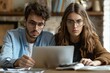 © Sandu - Persons looking laptop screen sitting table
