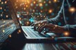© Sandu - Person typing on laptop with bright background lights