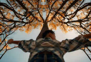 Sticker - AI generated illustration of downside view of blurred man standing under a tree with yellow flowers