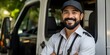 © Anastasiia - Delivery man posing with van smiling for photo in front of truck. Concept Delivery man, Posing, Van, Smiling, Truck, Photo