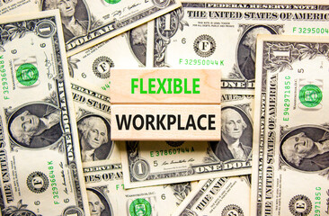 Flexible workplace symbol. Concept words Flexible workplace on beautiful wooden block. Beautiful dollar bills background. Dollar bills. Business Flexible workplace concept. Copy space.