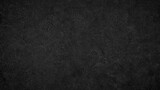 A black background with no visible objects. The background is dark and has a rough texture. It is a simple and minimalistic design