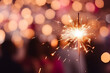 © Firn - Burning sparkler in front of bokeh lights and copy space