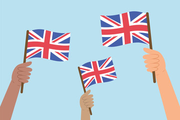 Diverse people hands raising flags of United Kingdom. Vector illustration of UK flags in flat style on blue background.