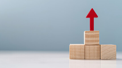 Aufkleber - Wooden blocks on a gradient background, topped with a red arrow symbolizing upward growth