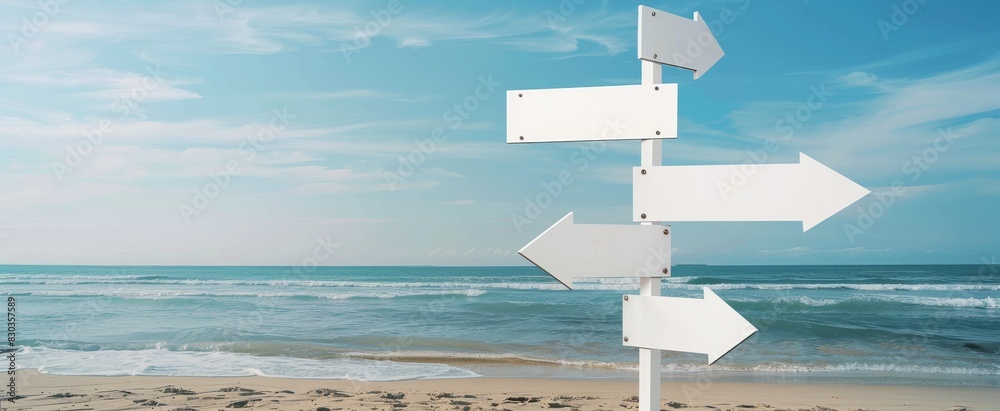 Three white blank road signs pointing in different directions on beach ...