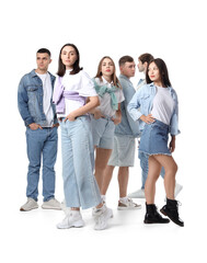 Wall Mural - Group of stylish young people on white background