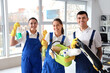 © Pixel-Shot - Young janitors with cleaning supplies in office
