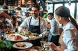 © At My Hat - A man in a chef's uniform is smiling as he serves food to a group of people. The atmosphere is lively and friendly, with everyone enjoying the meal