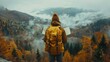 © familymedia - An explorer with a backpack and map faces a beautiful autumn mountain scene