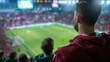 © Space Priest - A man is watching a soccer game with a crowd of people, football fans
