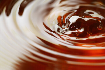 Poster - Macro shot of tea drink ripples as background