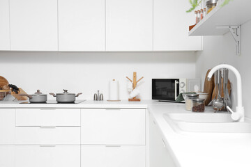 Canvas Print - Holder with roll of paper towels on counter in kitchen interior