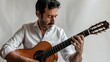 © AkuAku - Man performing on a guitar in front of a white backdrop