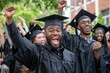 © kitipol - Multiethnic graduates in black caps and gowns, celebrating by lifting their diplomas and shouting with joy, having fun