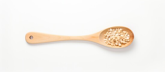 Canvas Print - Copy space image of minced garlic in a wooden ladle on a white table background seen from the top