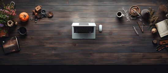 Poster - A top down view of a creative designer or photographer s work space on a dark wooden table with plenty of copy space for images