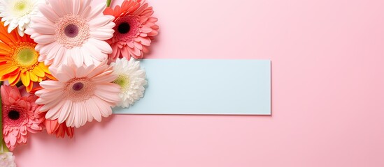 Canvas Print - Colorful background with an empty frame and gerbera flowers perfect for adding a copy space image