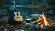 © Anna Iluschenko - A tourist backpack and a guitar on the background of a campfire near a lake in the mountains. September 27 - World Tourism Day. Leisure and travel concept