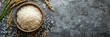 © Sunny_nsk - A bowl of white rice on a grey surface, wide panoramic banner with copy space.
