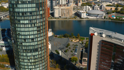 Wall Mural - Beautiful architecture of modern high-rise buildings with offices. Stock footage. Business centers in high-rise buildings with glass facade in city center. Top view of beautiful architecture of modern