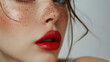 © RaptorWoman - A detailed close-up of a woman's face highlighting her red lips, freckles, and flawless skin, creating a striking and intimate portrait.