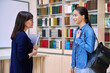 © Valerii Honcharuk - Female teacher talking to teenage girl high school student, inside educational building
