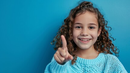 Wall Mural - The smiling girl pointing