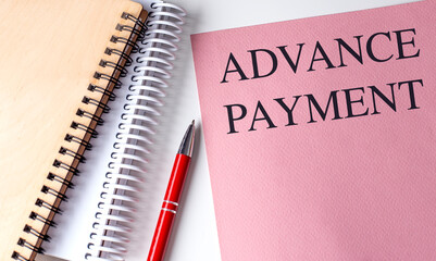Poster - ADVANCE PAYMENT text on pink paper with notebooks