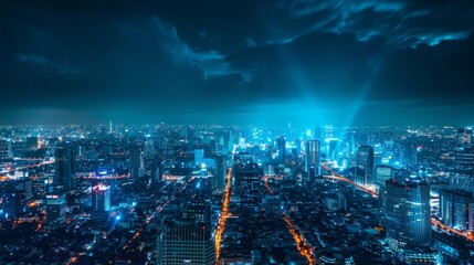 Wall Mural - A city at night with a blue sky and a few clouds