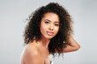 © peopleimages.com - African woman, skincare and portrait in studio for beauty, confidence and dermatology with glow. Treatment, pride and luxury by white background for cosmetics and results for natural afro or hair