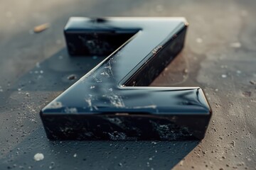 Sticker - Detailed shot of a black letter on a wet surface, suitable for various design projects