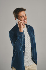 Poster - Studio, man and phone call with smile, funny news and comedy with contact. Creative worker, conversation and networking on smartphone with humor, chatting and connection by gray background with pride