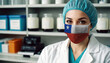 © Александр Бердюгин - Chile doctor wearing medical mask. Chile flag print on woman doctor's mask smiling in confidence giving hope