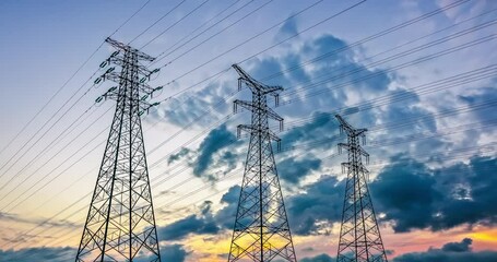 Canvas Print - Time-lapse of power towers and clouds at sunset