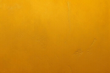 Yellow grunge texture. Abstract dark yellow background with scratches and cracks