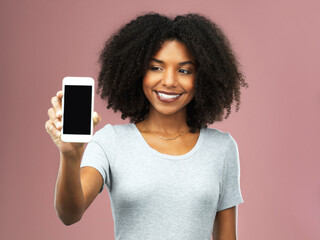 Phone screen, mockup and woman with smile in studio for advertising, information and digital promotion. Happy, female person and tech for elections, registration and voting on pink background