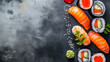 © SARATSTOCK - Japanese food. Perfect, fresh, delicious sushi on a copy space colorful background. Traditional Japanese Sushi set with sashimi and sushi rolls.