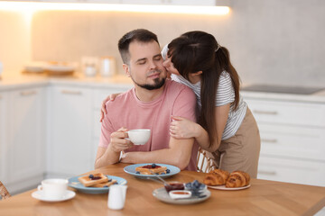 Sticker - Lovely couple spending time together during breakfast at home