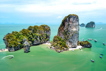 Wall Mural - Khao Tapu, James Bond Island, aerial shot from a drone, blue sea, emerald green, is a popular tourist attraction in Southern Thailand.