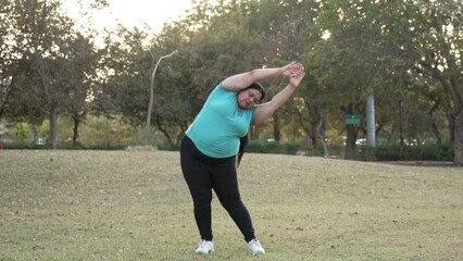 Wall Mural - Overweight indian woman exercising outdoors at summer park. Asian fat female Weight loss workout in nature, Plus size lady Fitness and healthcare, Mental health, Stress management, Obesity problem.