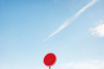 Wall Mural - Red circle traffic sign against blue sky