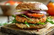 © kittipoj - Gourmet Cultured Meat Burger with Fresh Vegetables on Wooden Table Close-Up