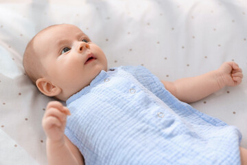 Sticker - Cute little baby lying in crib at home