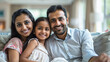 © Niks Ads - happy indian family sitting together at home