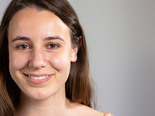 portrait of a woman, closeup of a smiling woman, natural skin, happy person