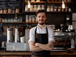 © qorqudlu - Confident and friendly male barista posing in a coffee shop, an ideal abstract of professionalism for a best-selling background or wallpaper image