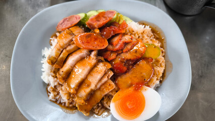 Wall Mural - Crispy pork rice on a blue plate on the dining table