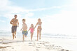 © Grady Reese/peopleimages.com - People, beach and running with holiday, family and happiness with weekend break, adventure and bonding together. Parents, mother or father with children, kids and seaside for joy, smile or travel